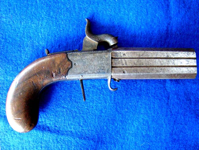 An English .40 cal. percussion pocket pistol with swivel over and under barrells by Wood & Son, York, circa 1850 — image 2